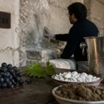 Pressoria voyage sensoriel au coeur du champagne : craie humide, raisins Pinot noir et table inox à Aÿ-Champagne